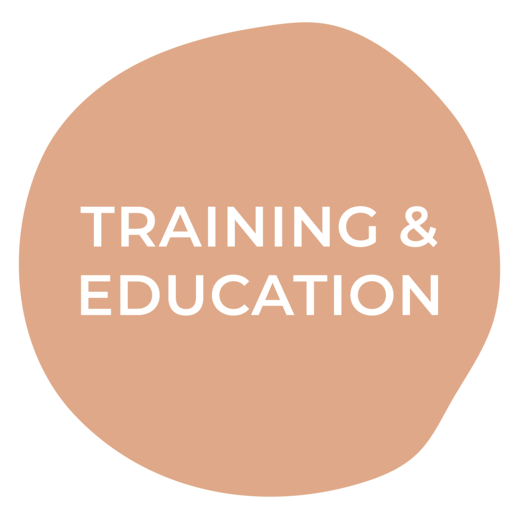 A pink circle with the words training and education